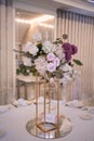 Table setting at a luxury wedding reception. Beautiful flowers on the table. Royalty Free Stock Photo