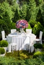 Table setting at a luxury wedding reception in the garden Royalty Free Stock Photo