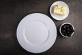 Table setting for a meal.White plate Royalty Free Stock Photo