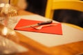 Table setting with napkin, silverware in a bright red color Royalty Free Stock Photo