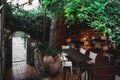 Table setting outdoor. Al fresco cafe with empty chairs in a garden