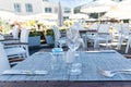 Table setting outdoor terrace. Nobody in the picture just table setup with cutlery and glasses Royalty Free Stock Photo