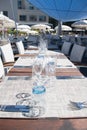 Table setting outdoor terrace. Nobody in the picture just table setup with cutlery and glasses Royalty Free Stock Photo