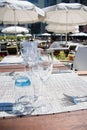 Table setting outdoor terrace. Nobody in the picture just table setup with cutlery and glasses Royalty Free Stock Photo