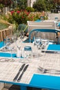 Table setting outdoor terrace. Nobody in the picture just table setup with cutlery and glasses Royalty Free Stock Photo