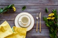 Table setting with plates, flatware and flower on wooden background top view Royalty Free Stock Photo