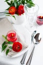 Table setting with red buttercup flowers Royalty Free Stock Photo