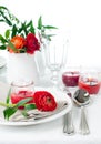 Table setting with red buttercup flowers Royalty Free Stock Photo