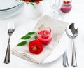 Table setting with red buttercup flowers Royalty Free Stock Photo