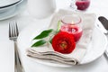 Table setting with red buttercup flowers Royalty Free Stock Photo