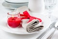 Table setting with red flowers Royalty Free Stock Photo