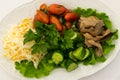 Table setting in a restaurant. Dish from the menu with cold snacks. Sauerkraut, mushrooms, tomatoes, cucumbers, lettuce