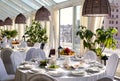 Table setting in restaurant. Wedding reception song white table, fruit and glasses Royalty Free Stock Photo