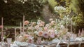 Table setting with rose flowers and candles for an event party or wedding reception in summer garden. Royalty Free Stock Photo