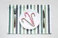 Tablesetting in white and green colors.Holiday