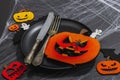 Table setting, traditional festive composition for Halloween party. Funny seasonal props