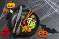 Table setting, traditional festive composition for Halloween party. Funny seasonal props