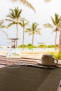 Table setting in tropical resort. Table set near resort pool. Cutlery on table of outdoor restaurant. Royalty Free Stock Photo