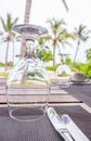 Table setting in tropical resort. Table set near resort pool. Cutlery on table of outdoor restaurant. Royalty Free Stock Photo