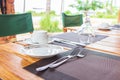 Table setting in tropical resort. Table set near resort pool. Cutlery on table of outdoor restaurant. Royalty Free Stock Photo