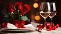 Table setting for Valentine\'s Day. Romantic atmosphere in a restaurant with two glasses of wine, red roses in a vase, white