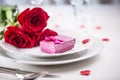 Table setting for valentines or wedding day with red roses. Romantic table setting for two with roses plates cups and cutlery Royalty Free Stock Photo