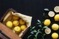 Table setting with variety shape of lemons and lemons leaves