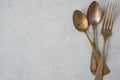 Table setting in vintage style. Antique fork, knife, spoon on old light  background. Space for text, flat lay Royalty Free Stock Photo