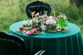 Table setting. Wedding decor in the magic forest for a loving couple. Pink and green colors. Raspberry dessert. Royalty Free Stock Photo