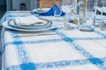 Table setting with white plates, vintage silverware, linen napkins. Side view point