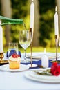 Table setting, wine is poured into a wineglass