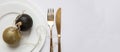 Table setting, xmas, new year. Gold cutlery on white set of dishes, white background
