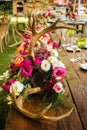 Table setup, wedding guest table, reception layout in pantone living coral and deer horns Royalty Free Stock Photo