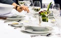 Table side service at a fine dining restaurant, Waiter serving dishes to the table Royalty Free Stock Photo