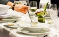 Table side service at a fine dining restaurant, Waiter serving dishes to the table Royalty Free Stock Photo