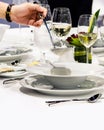 Table side service at a fine dining restaurant, Waiter serving dishes to the table Royalty Free Stock Photo