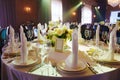 table with sign for number or names of guests in banquet hall of restaurant. Royalty Free Stock Photo