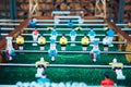 Table soccer. Blue and yellow team players in table football or a kicker football game Royalty Free Stock Photo