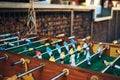 Table soccer. Blue and yellow team players in table football or a kicker football game Royalty Free Stock Photo