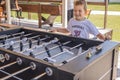 Table soccer. Foosball in a childrens playroom. Close-up during the game. Soccer table kids home toys, football family game table Royalty Free Stock Photo