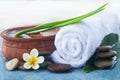 Table with spa objects and tropical flower, stones for massage Royalty Free Stock Photo