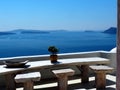 Table With Stools In Fira Greece Overlooking The Sea