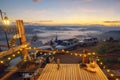 Table Stove and chair in camping and tent with sunrise and fog on the mountain