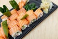 On table sushi roll food fish philadelphia japanese salmon delicious sushi rice cucumber meal traditional wasabi fresh healthy