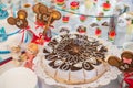 Table with sweets, birthday cake, cocktails, pastries.