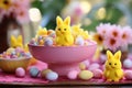 Table with sweets for Good Friday. Chocolate colorful eggs and marshmallow bunnies Easter peeps