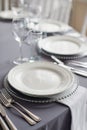 a table with a tablecloth, beautiful serving of white dishes, a beautiful plate, dinner in a restaurant Royalty Free Stock Photo