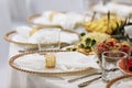 a table with a tablecloth, a beautiful serving of white dishes, a beautiful plate, dinner in a restaurant Royalty Free Stock Photo