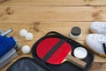 Table tennis paddle in open case with other mandatory equipment