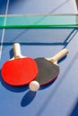 Table tennis ping pong two paddles and white ball Royalty Free Stock Photo